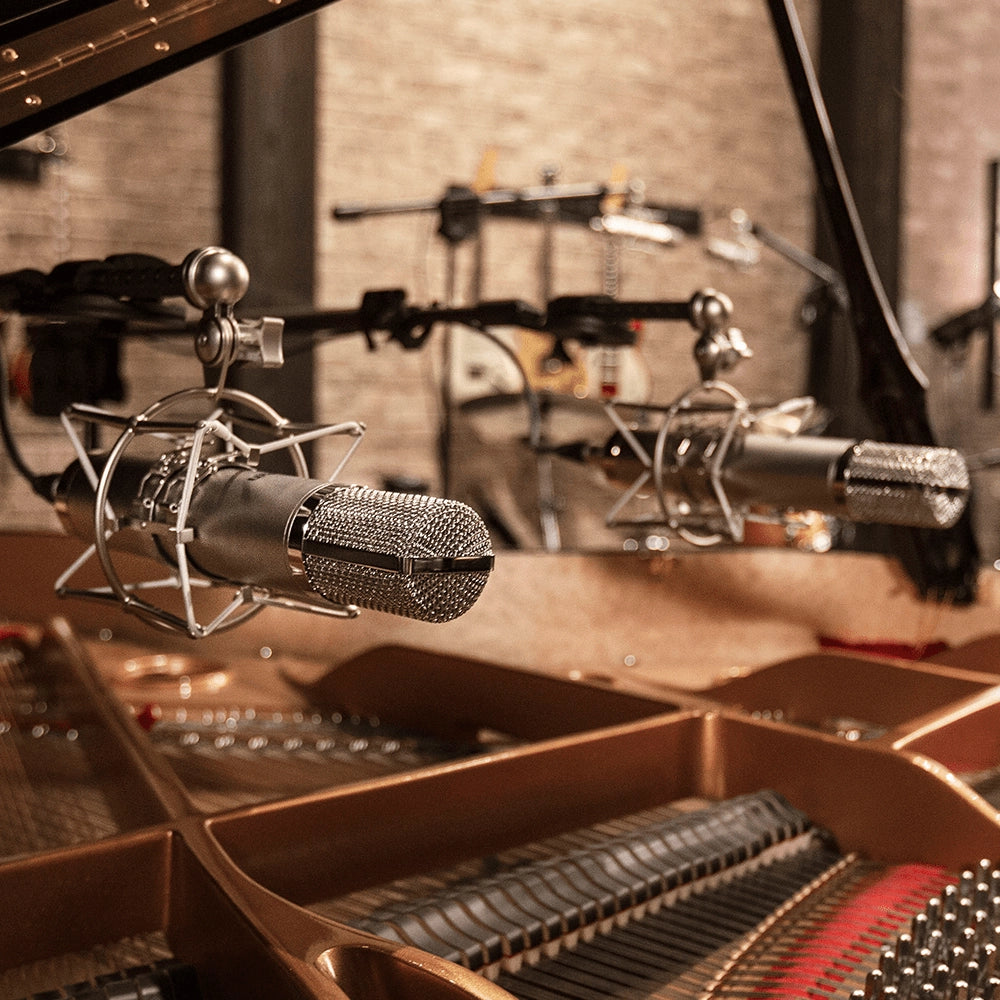 View of Warm Audio WA-CX12 Tube Condenser Microphone in a grand piano