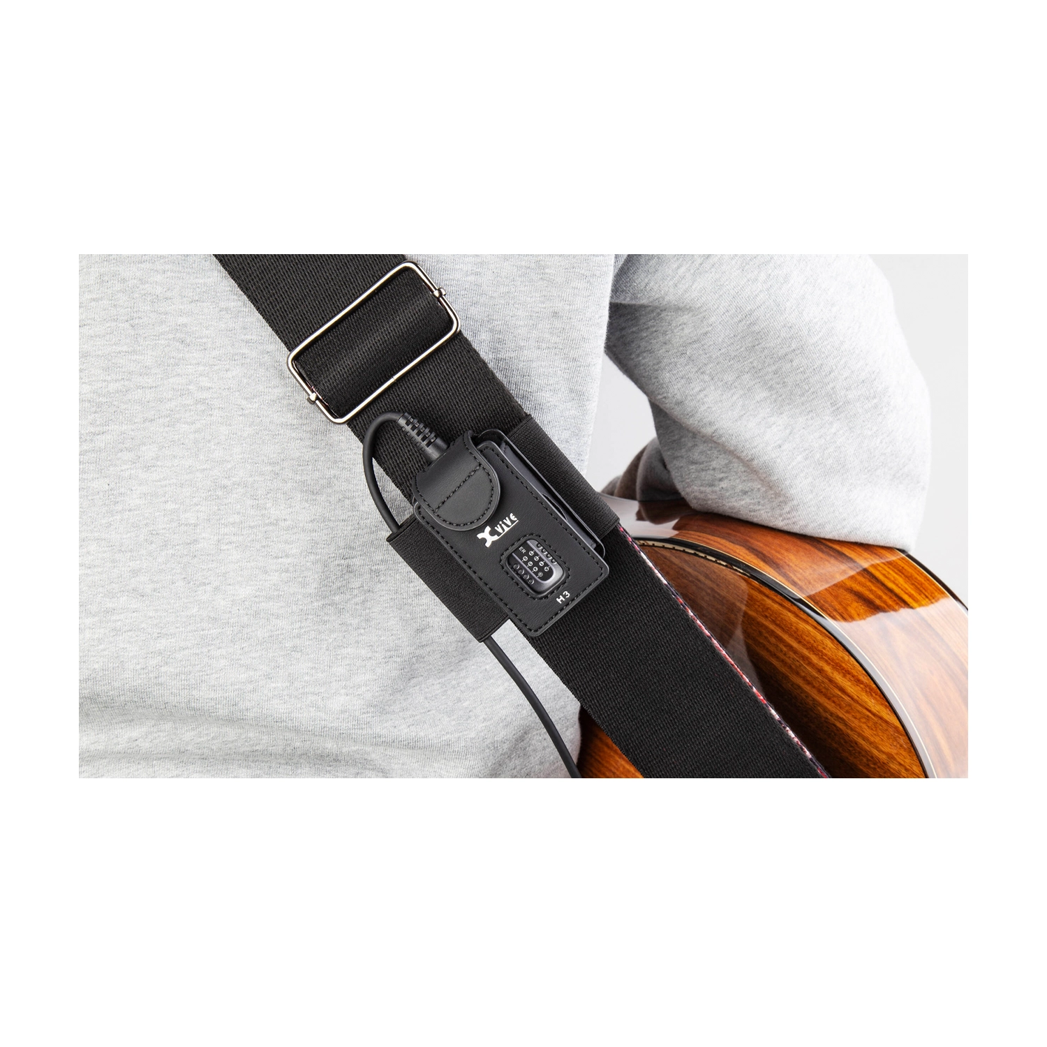 Xvive H3 Transmitter Holder For Xvive A58 And P58 on guitar strap