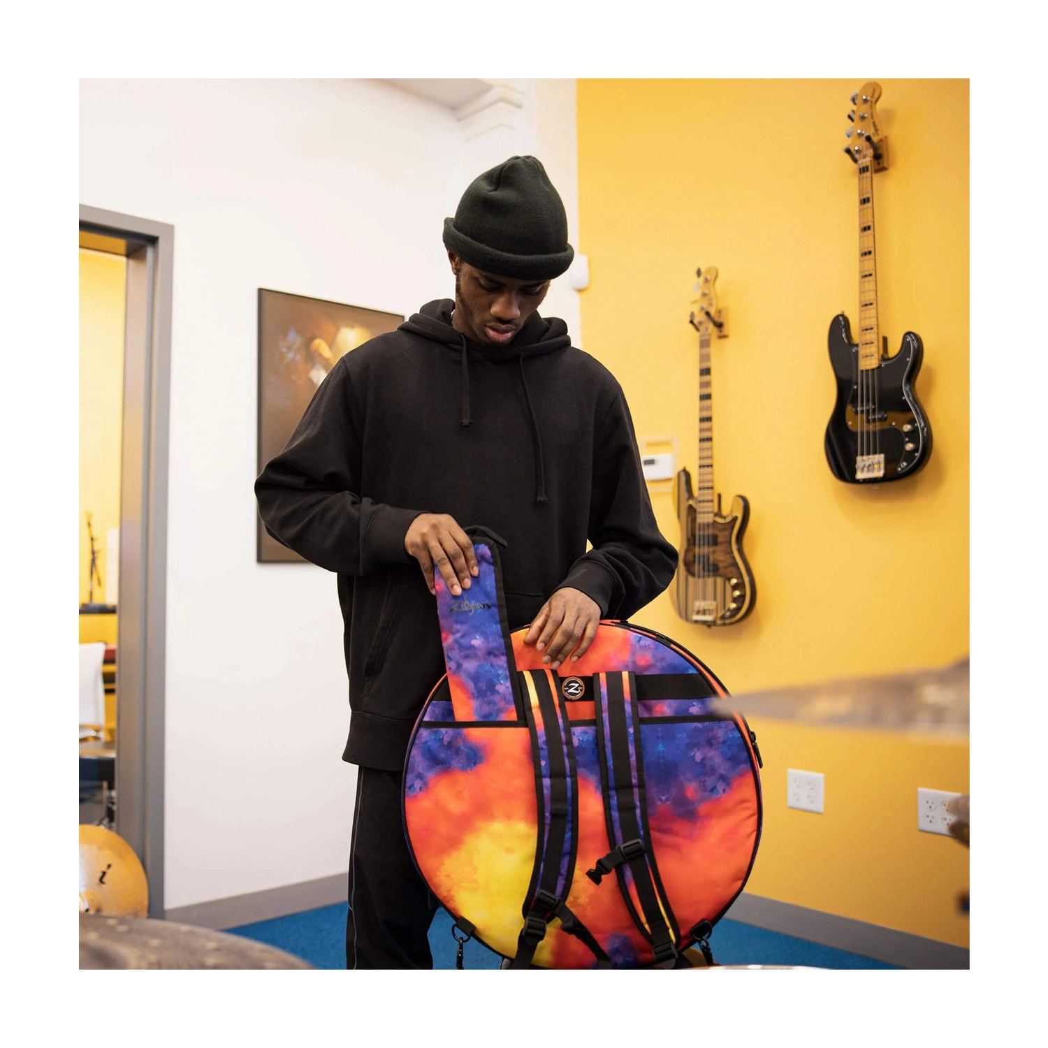 ZXCB00220 Lifestyle, Drummer getting ready for practice session.