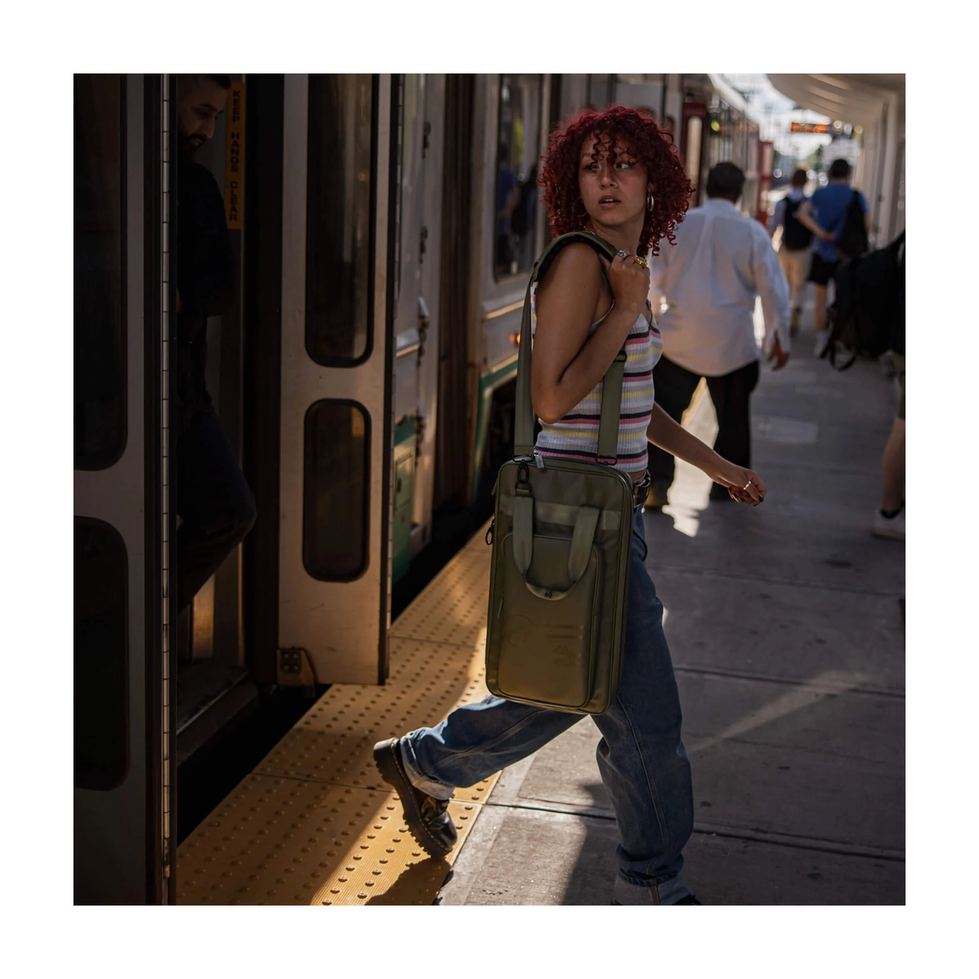 ZXSB00602 Lifestyle getting out of the Train at the Station on Tour.