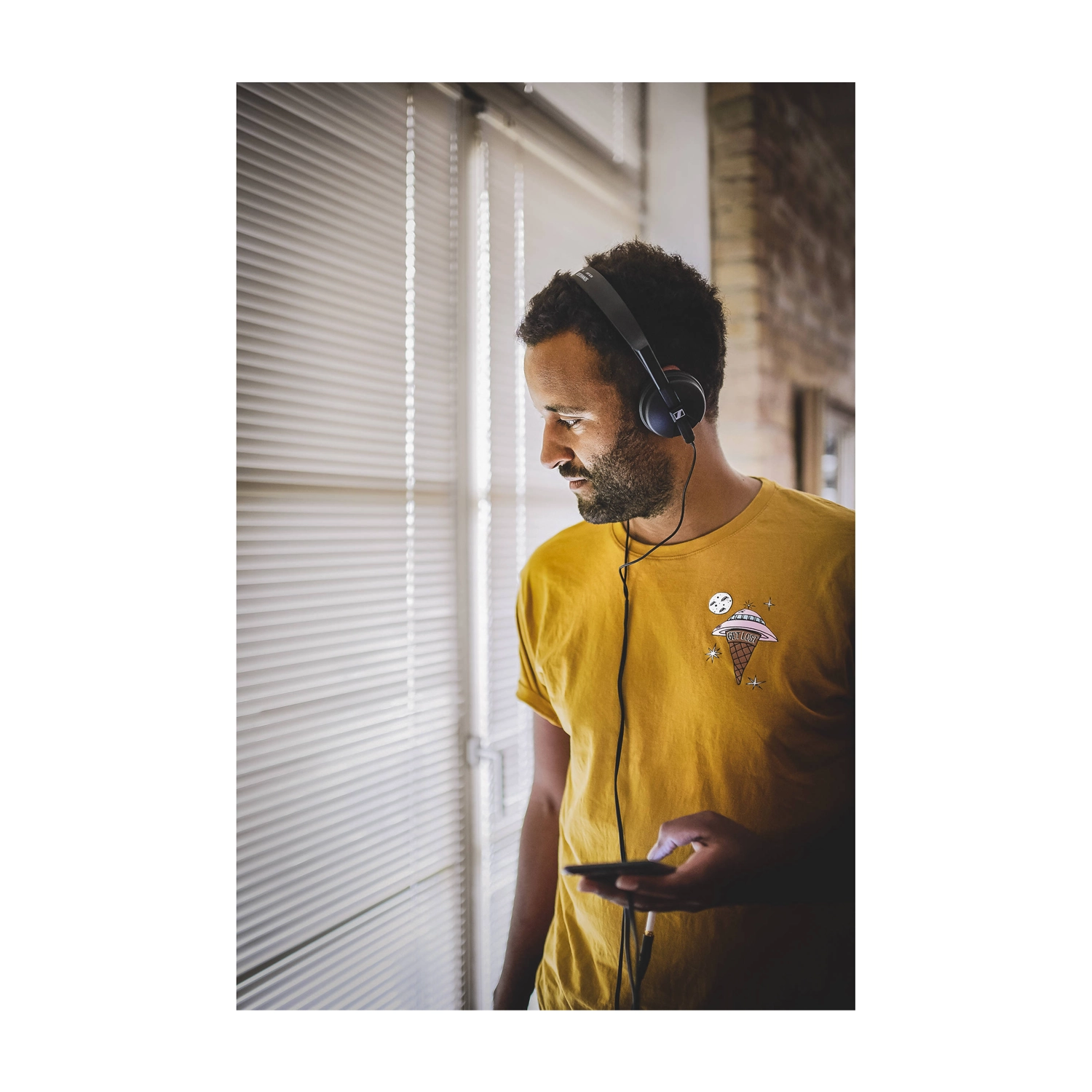 View of Sennheiser HD 25 Light - Lightweight Closed-Back On-Ear Studio Headphones on a person