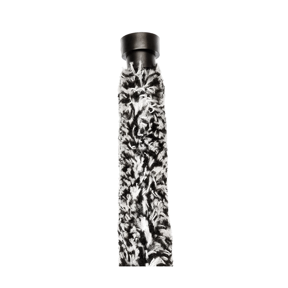 A black and white image of a padguard for an alto saxophone, designed to absorb moisture.