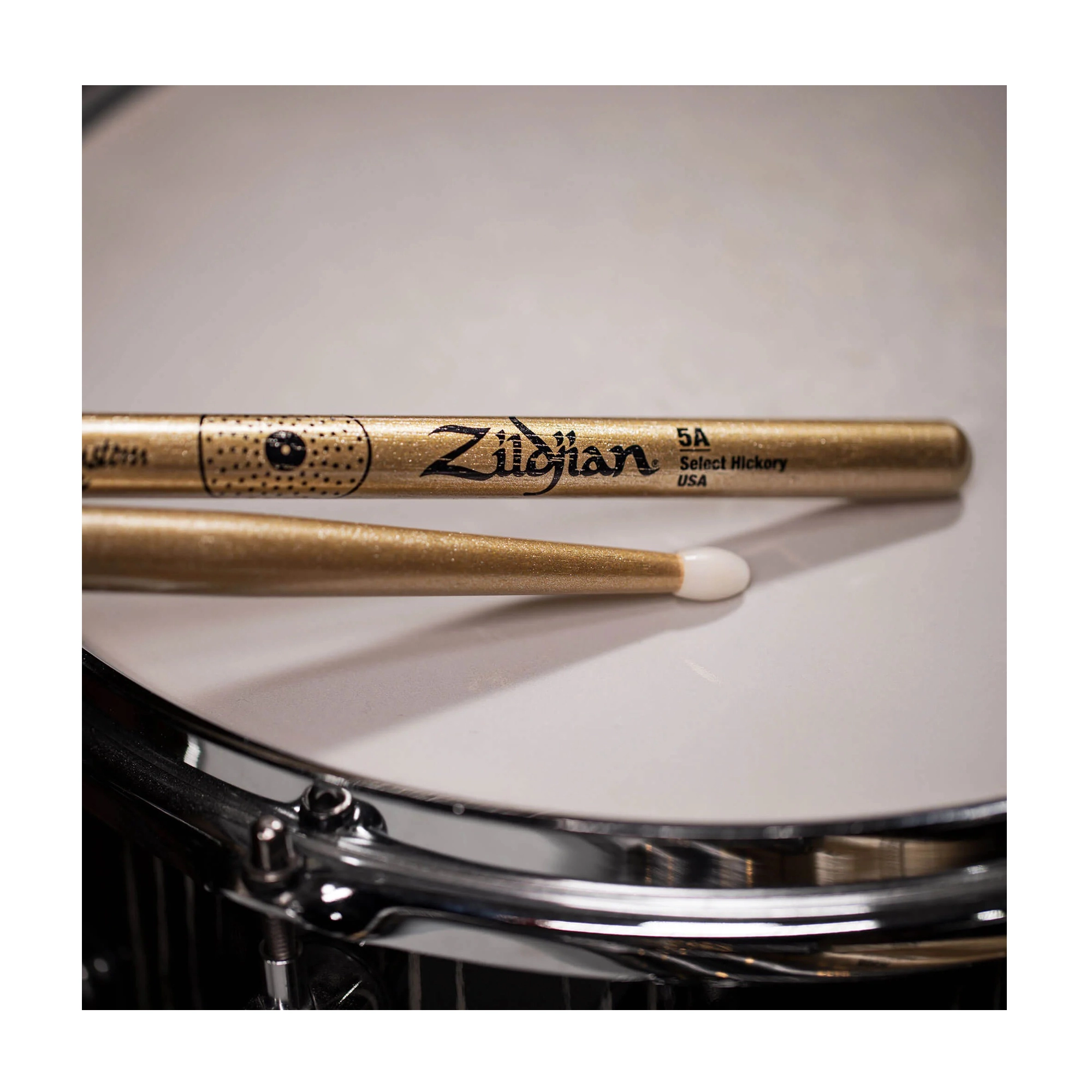 Close-up view of Zildjian Z5ACGN-ZC Z Custom Limited-Edition Gold Chroma Drumsticks - 5AN in a Snare