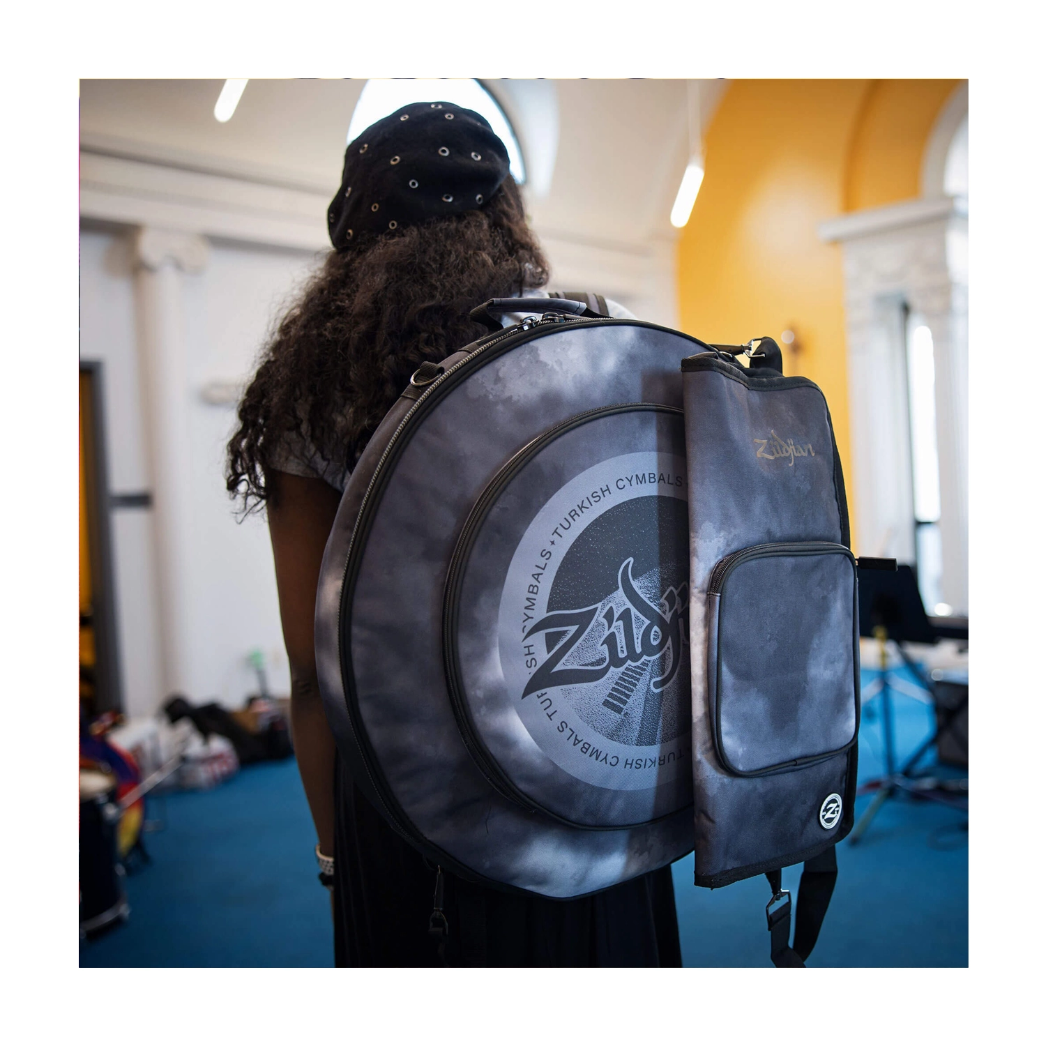 ZXCB00220 Lifestyle, Drummer walking to practice session.